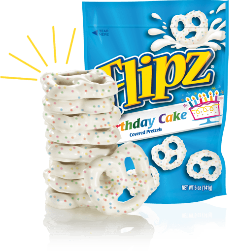 Photograph of pretzel packet, with stack of frosted pretzels in front of it.