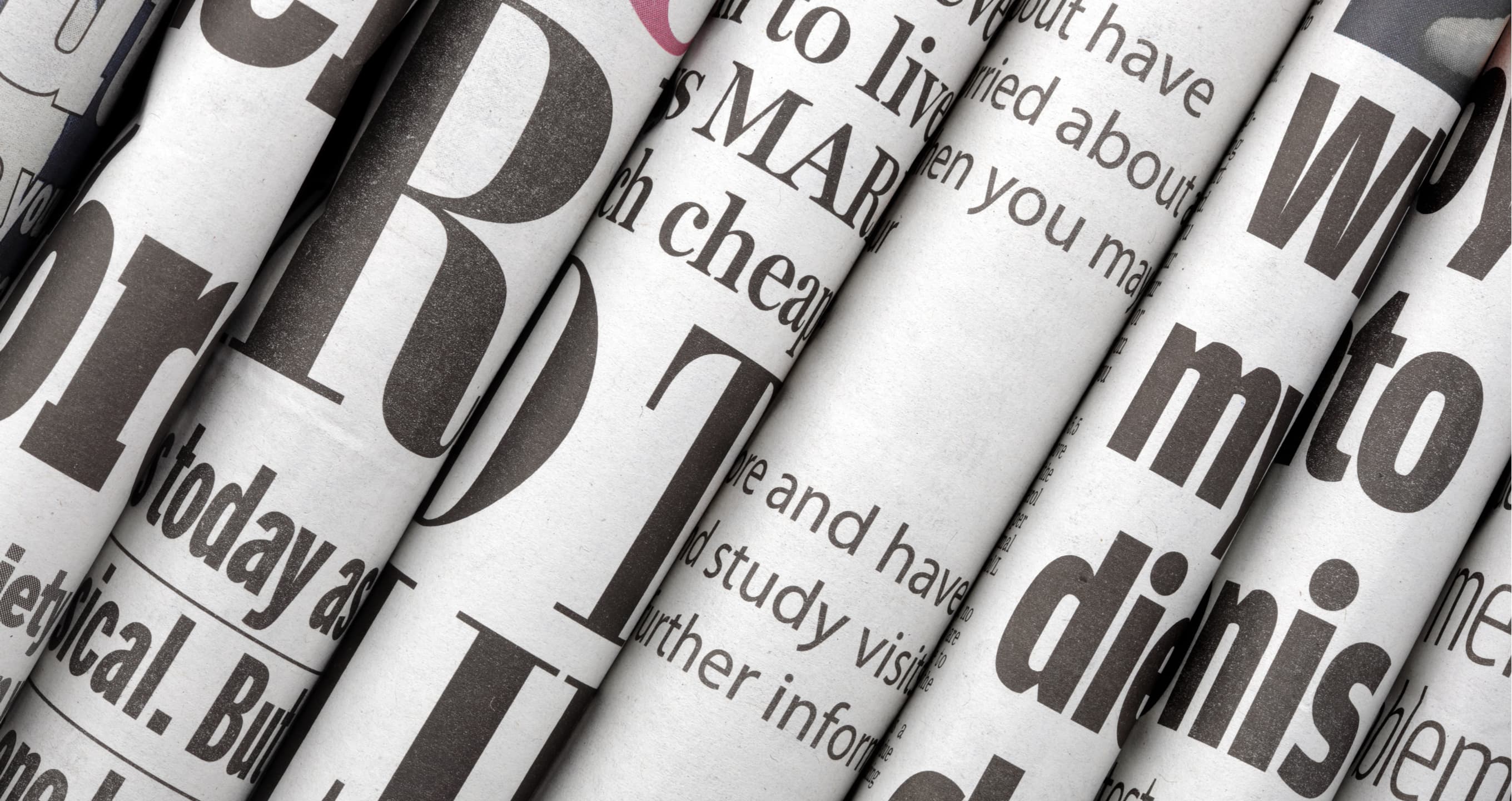 Credit: Newspaper headlines shown side on in a stack of daily newspapers by Brian A Jackson on Shutterstock