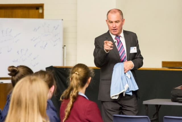 Former Socceroo Captain Paul Wade helps refugees