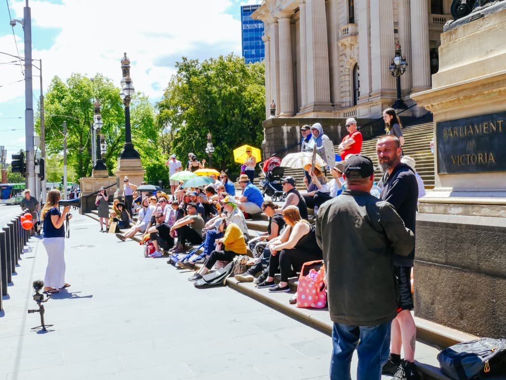 Angry protestors camp-out at Victoria’s parliament over pandemic laws