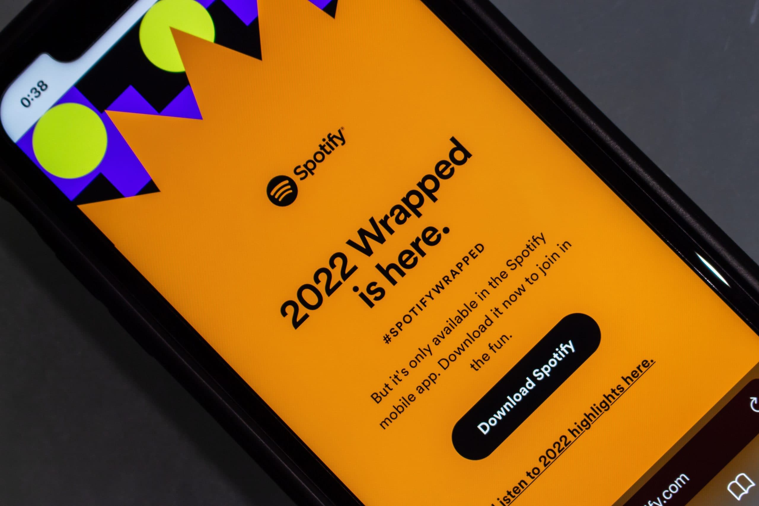 Phone displaying image that says "Spotify: 2022 Wrapped is here."