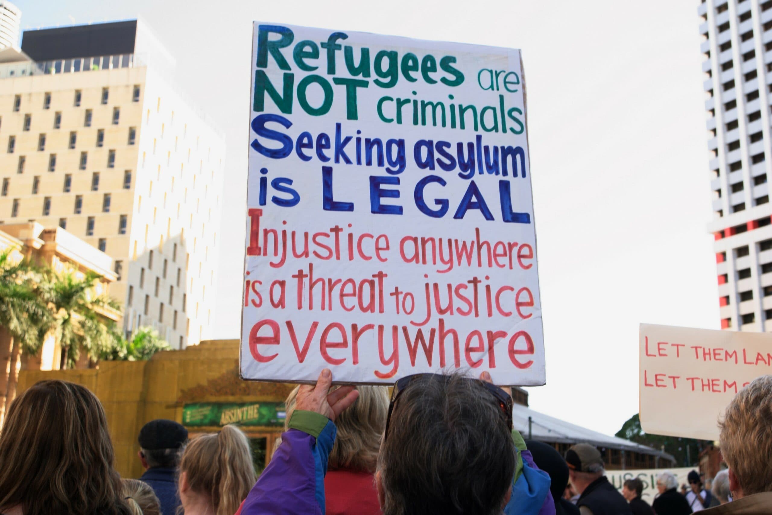 Refugees and mayoral candidate call for government action on visas in Brisbane