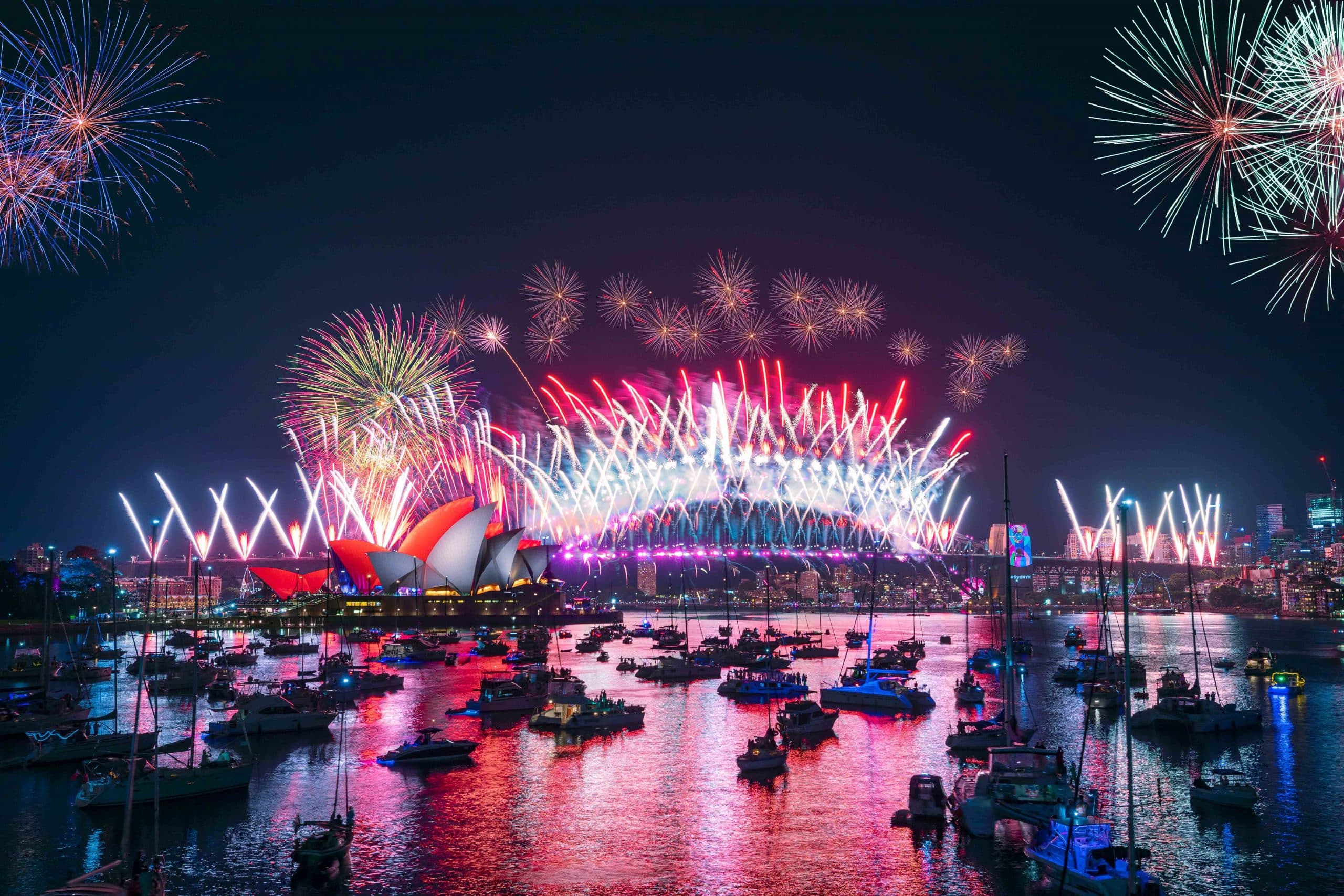 Sydney Harbour on New Year's Eve, lit up with fireworks. Image Credit: Daniel Tran