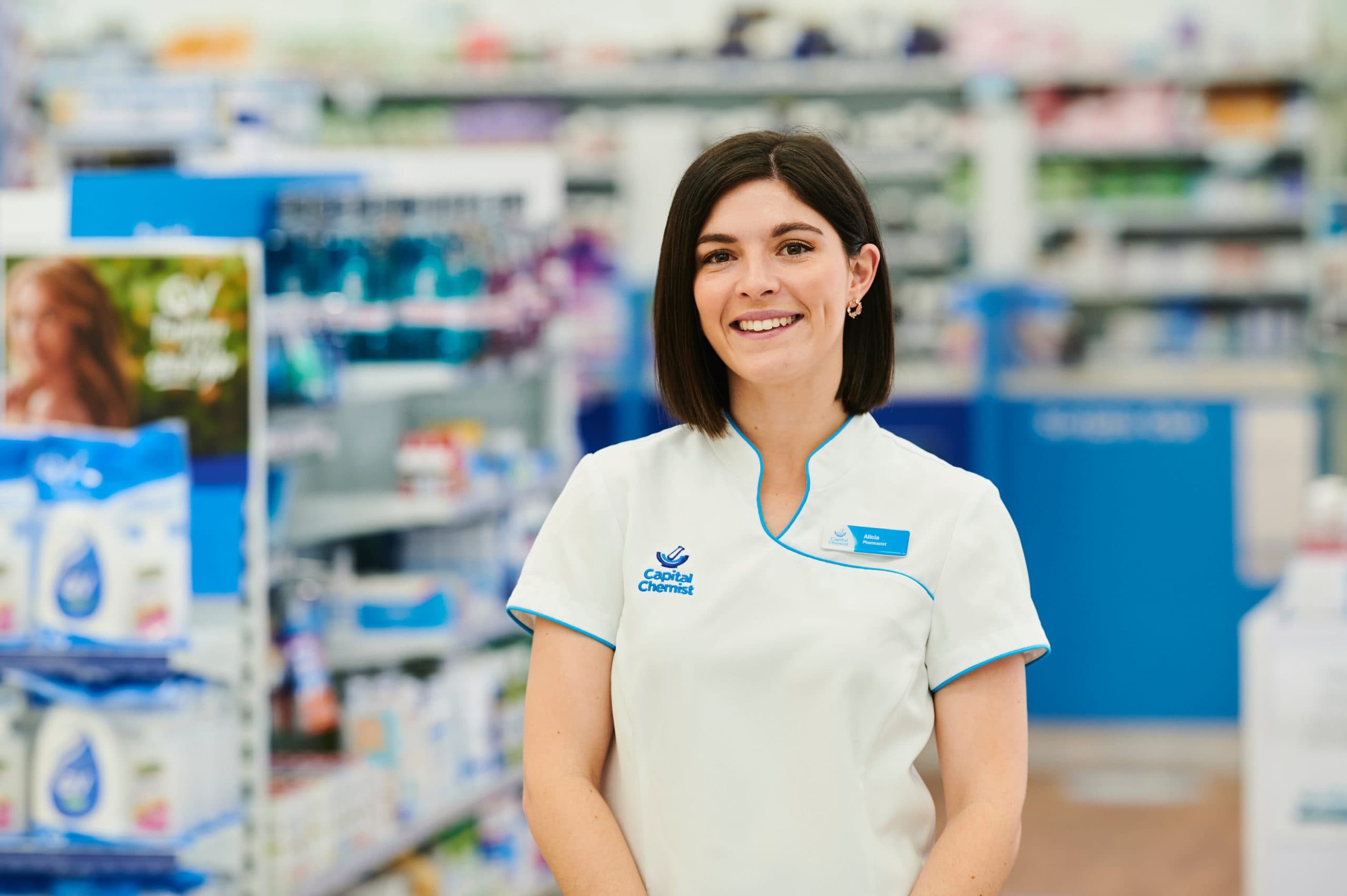 Pharmacist Alicia Martin in her uniform at a chemist