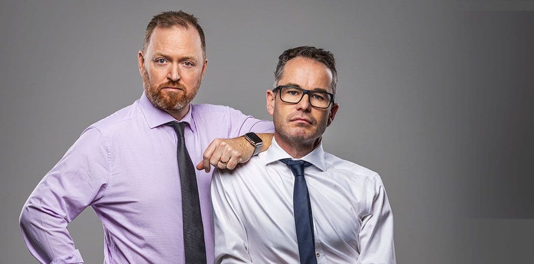 Two men in office attire.