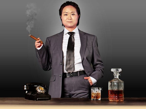 Photo of He Huang dressed as her character, billionaire white man Christopher Rice