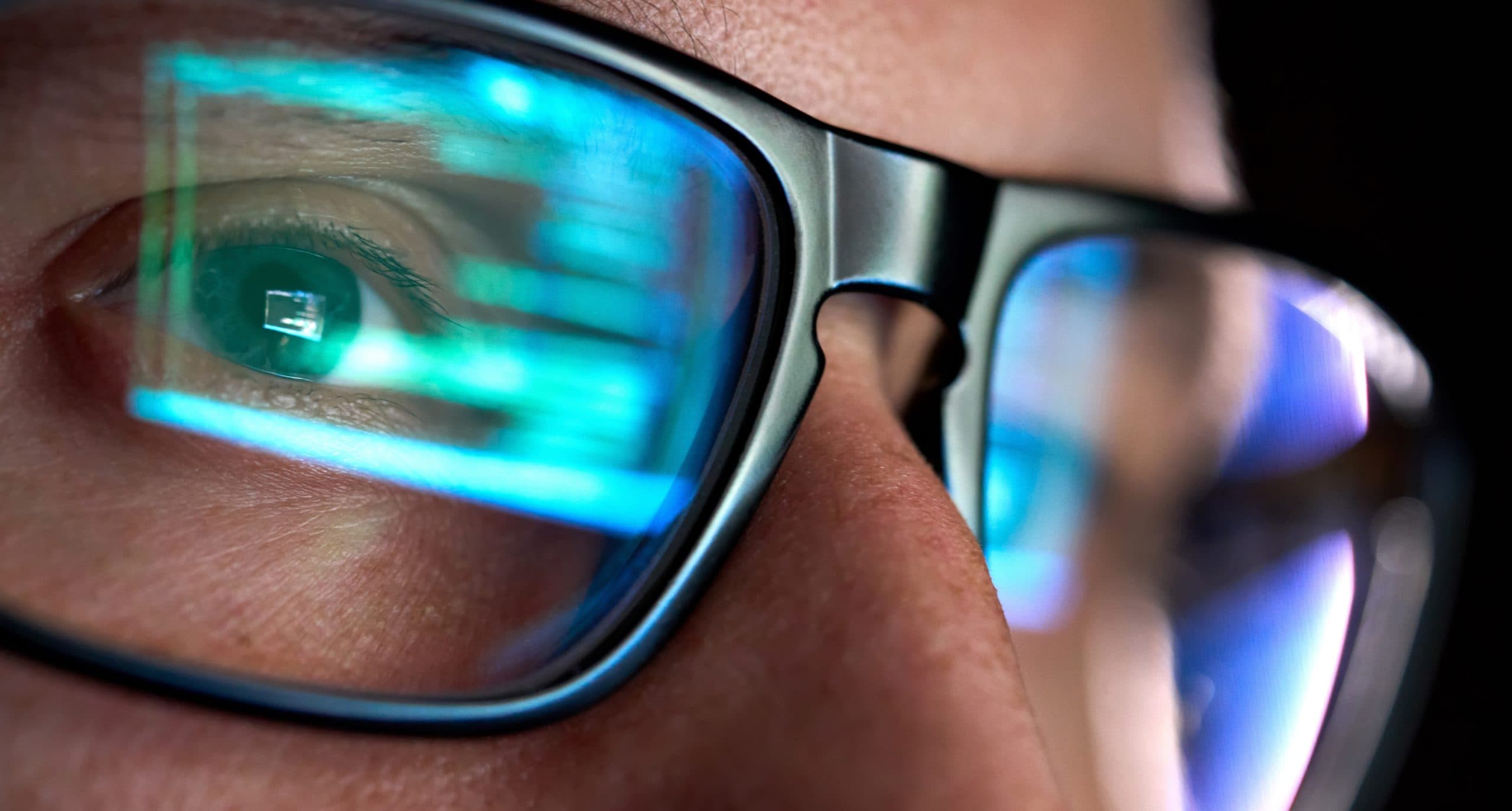 image of a pair of glasses reflecting some code
