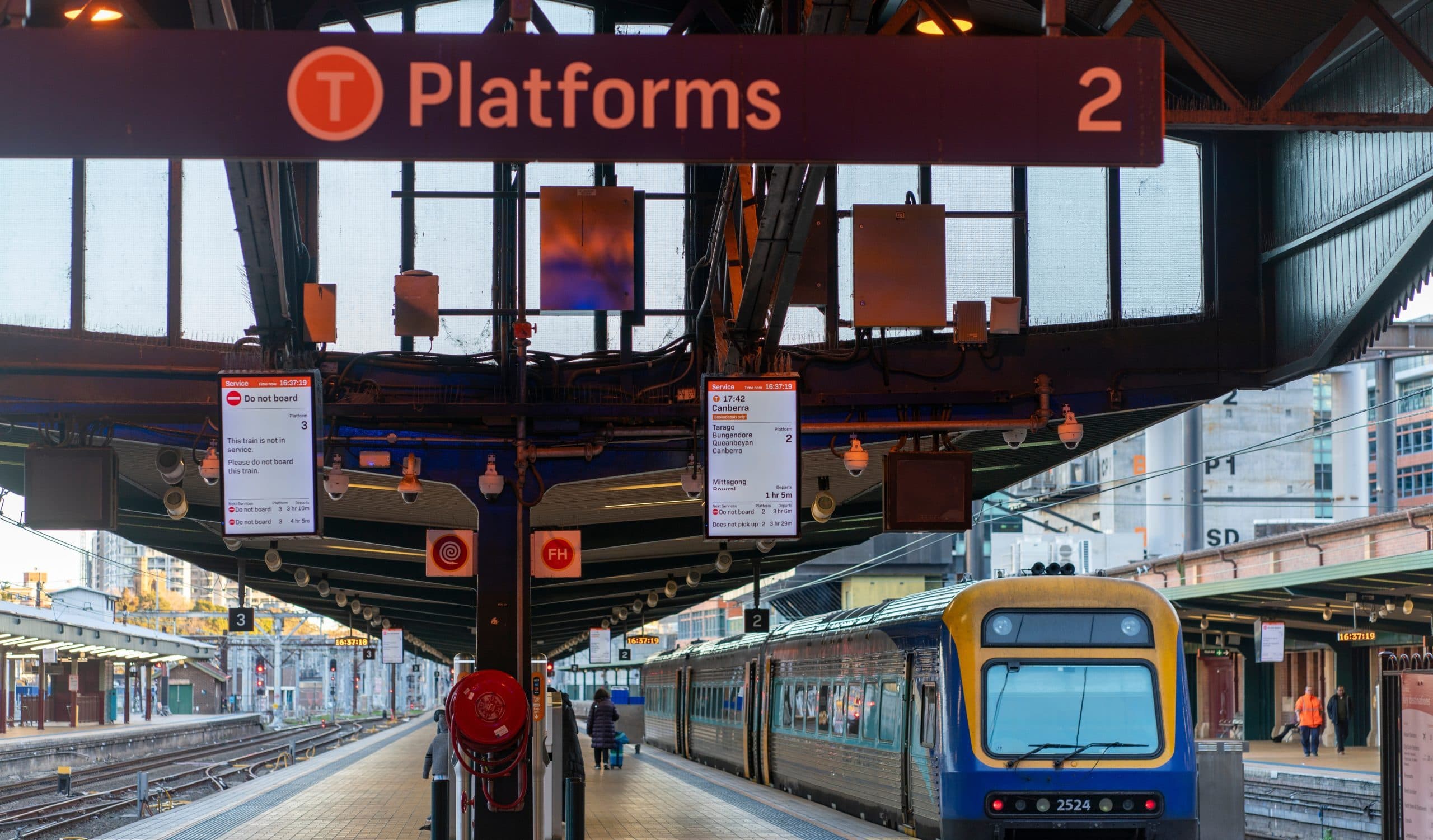 Central Station Sydney - a view down one of the intercity platforms with the Canberra train standing at the right hand side. Taken in July 2024 mid afternoon. Credit jixiang liu/Shutterstock