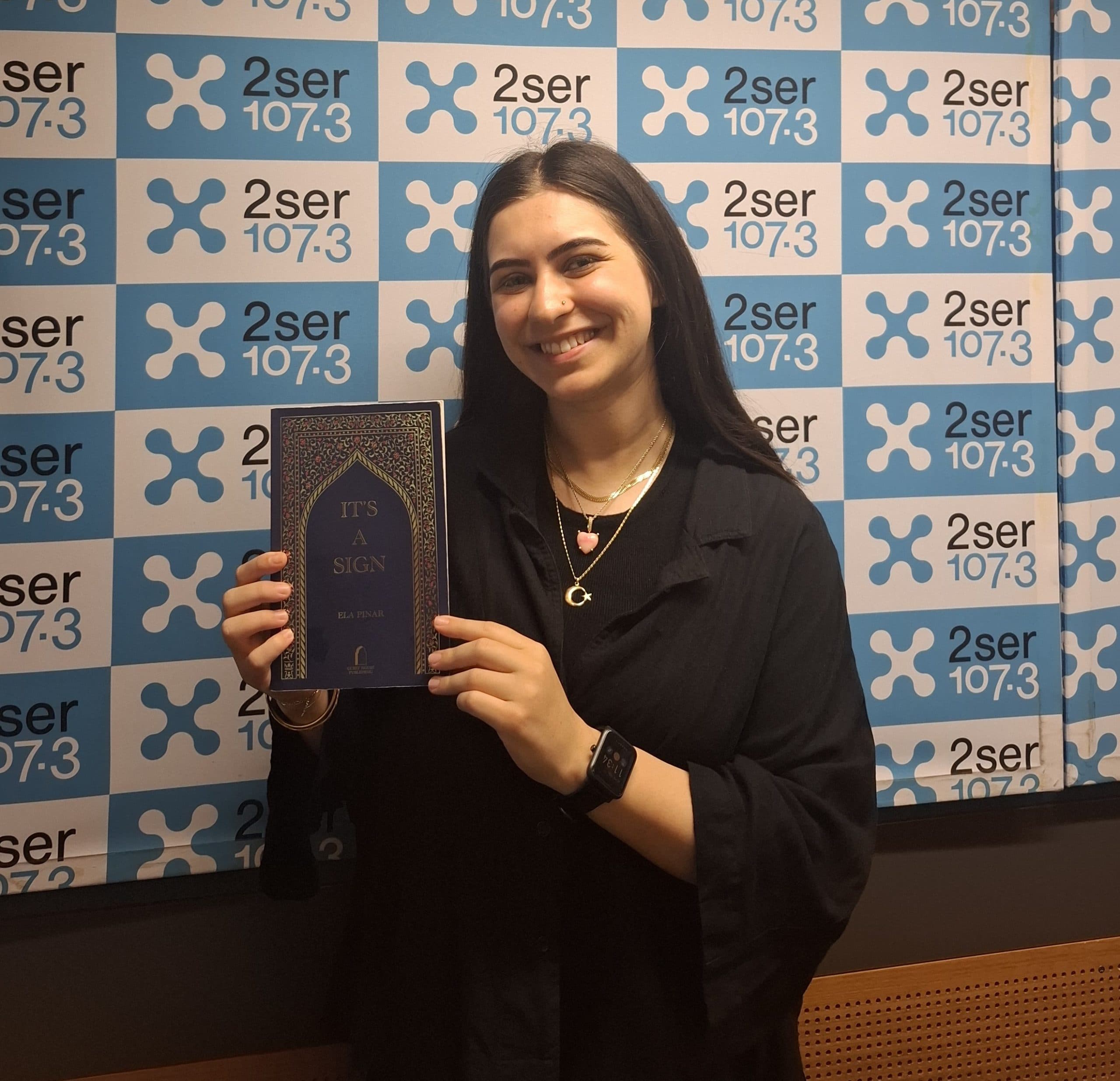 Ela Pinar’s debut poetry collection “It’s A Sign”